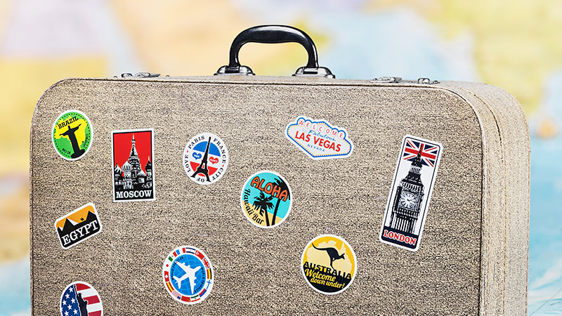 Luggage with location stickers on it
