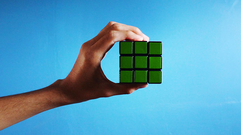 Rubix cube in hand